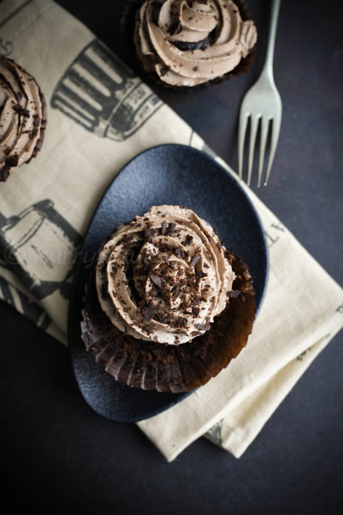 perfect chocolate cupcakes on black platter
