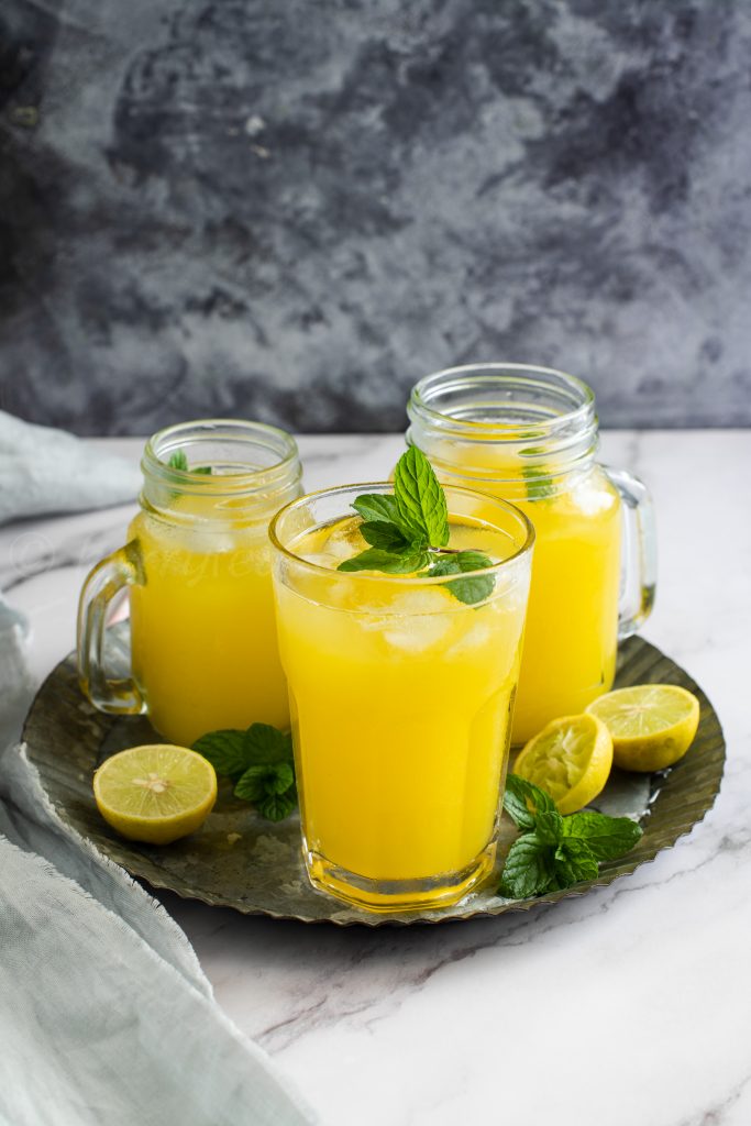 Refreshing mango lemonade with mint leaves