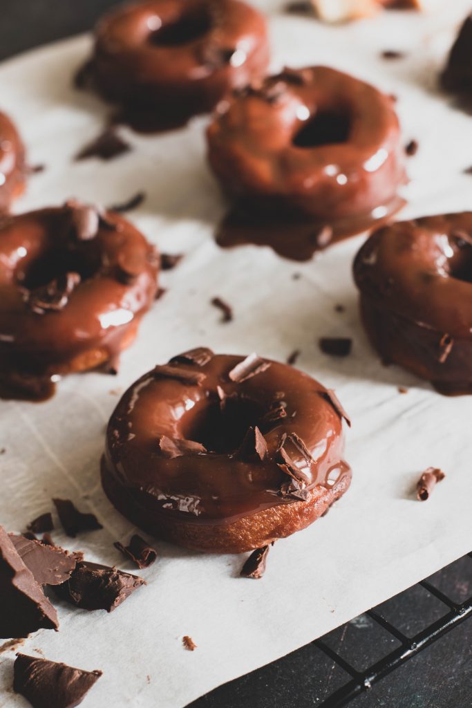 eggless doughnuts with chocolate glaze and grated chocolate